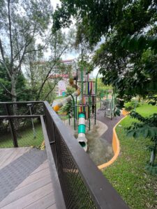 Elevated boardwalk overlooking children's playground at Bukit Batok Neighbourhood Park