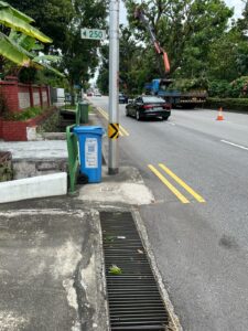 Narrow footpath along Dunearn Road, obstructed by lamp pole and rubbish bin