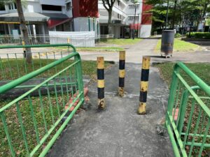 Bollards impeding access to street along Lorong Chuan near Block 309 Serangoon Ave 2