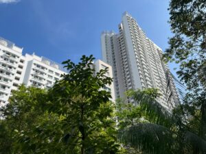 A tower block in Casa Clementi rising up above the trees