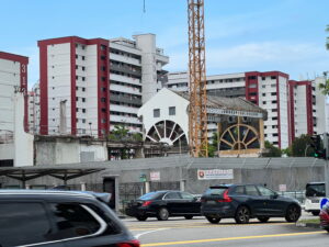 A close up of the construction site, with the facade of the old Community Club's sports hall retained, apparently for incorporation in the revamped club building.