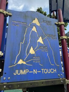 Some interesting playground equipment. I guess you're meant to jump, and based on how high you manage to reach, "summit" one of these mountains. 